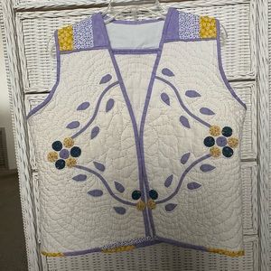 One of a kind.  Quilted vest made from vintage quilt.
